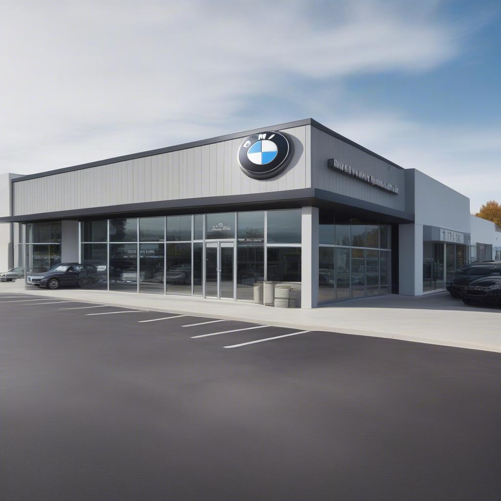 BMW body shop uy tín: Hình ảnh mặt tiền của một BMW body shop hiện đại, sạch sẽ và chuyên nghiệp. Bên ngoài có biển hiệu BMW rõ ràng, bãi đậu xe rộng rãi và một vài chiếc BMW đang đậu. Cửa kính trong suốt cho phép nhìn thấy bên trong xưởng dịch vụ với các trang thiết bị hiện đại.